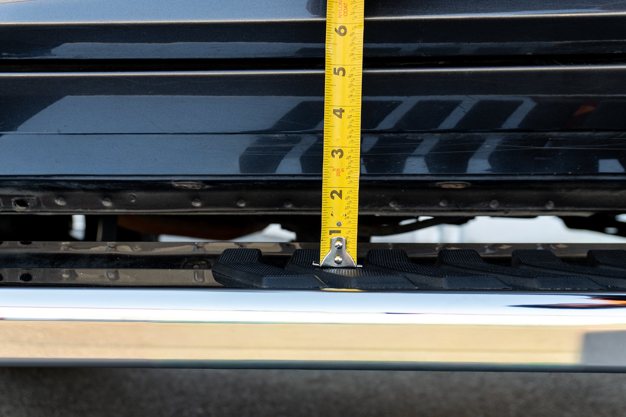 An image of a grey RAM 1500 with CYC Engineering's OEM style full tread running boards installed. 