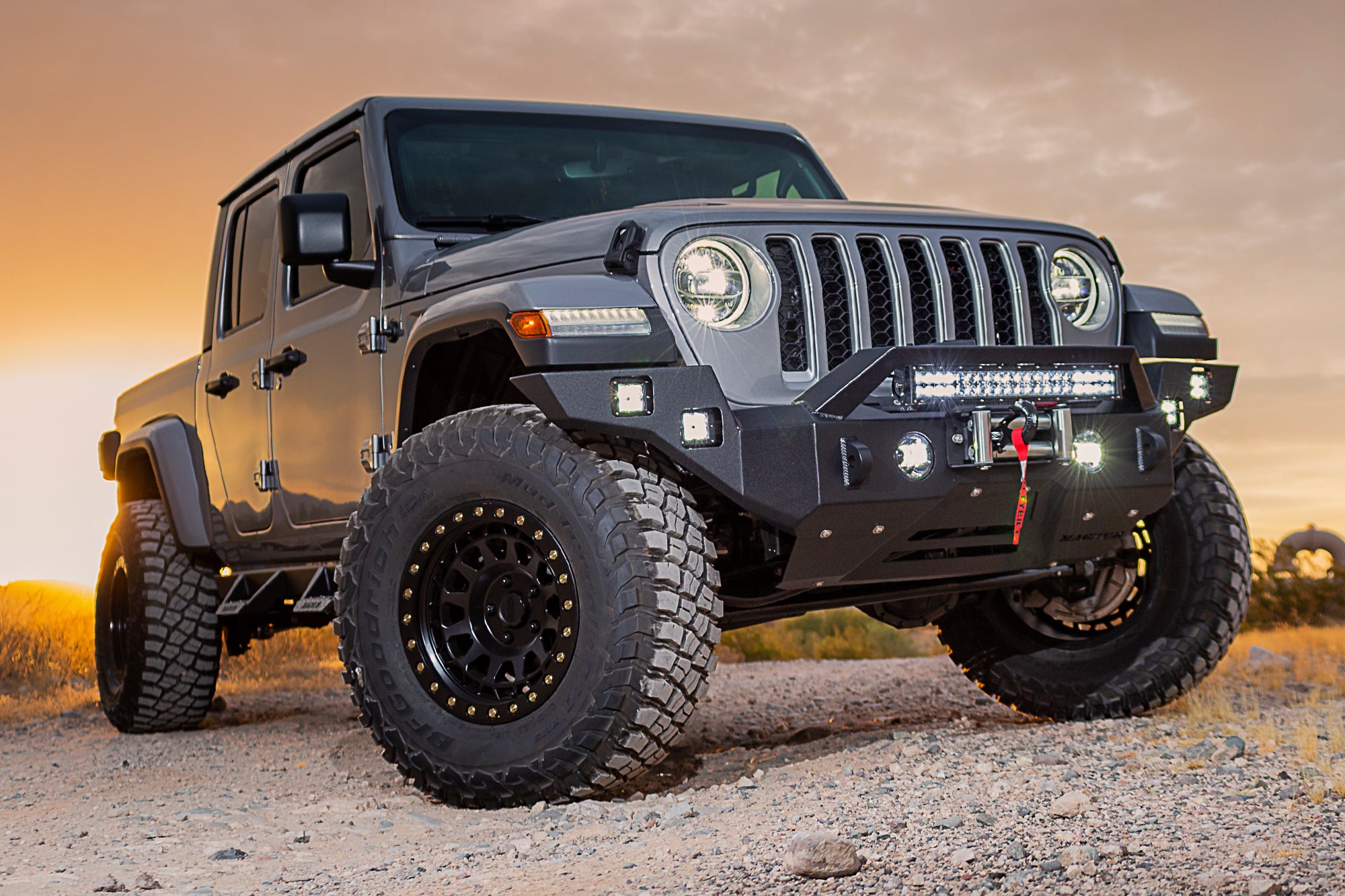An image of a silver Jeep with a black bumper from CYC Engineering installed.